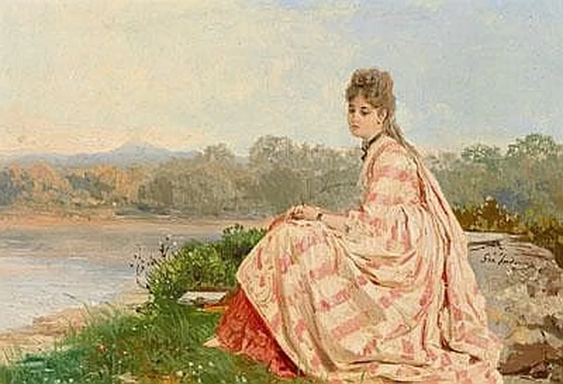 Giovane ragazza seduta sulla riva del fiume